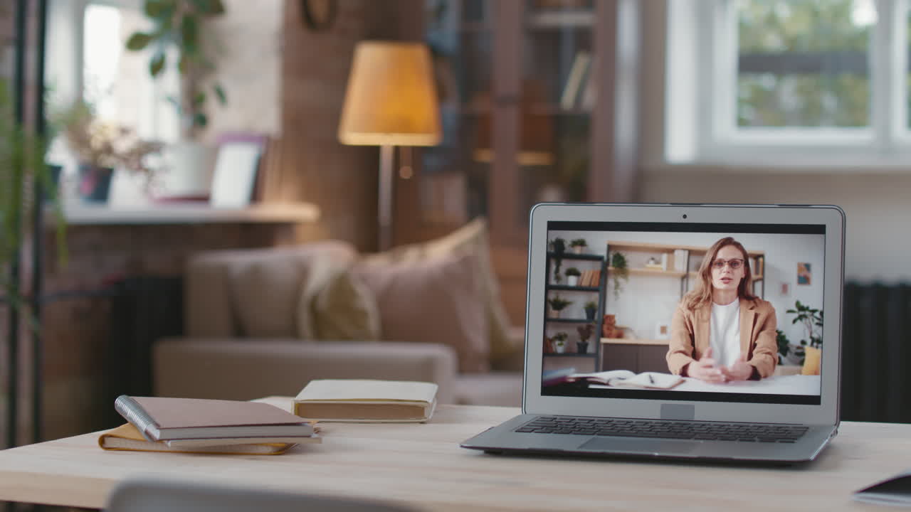 Woman in a video call on a laptop at home