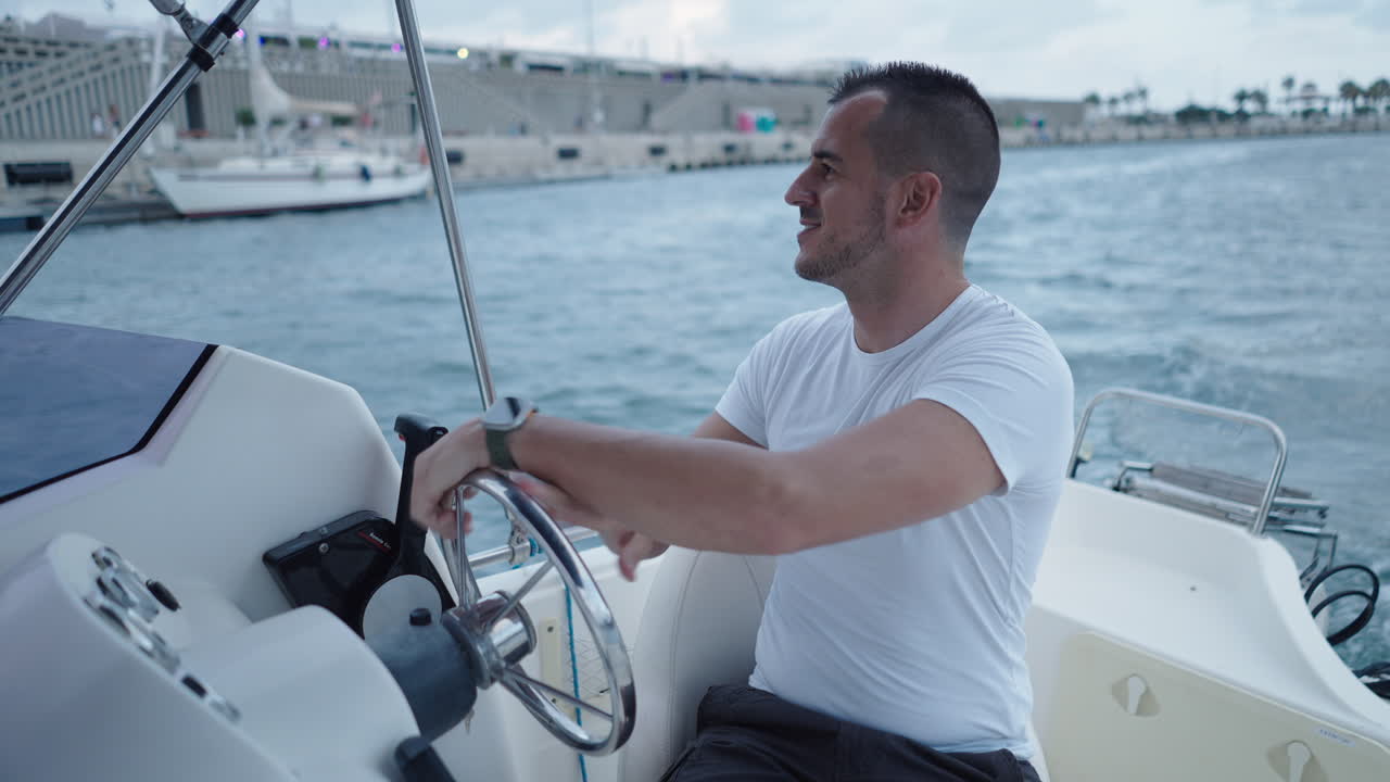 Man driving a small boat on the water