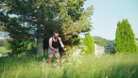 Caucasian-Man-Trimmed-Growing-Grass-On-A-Sunny-Day