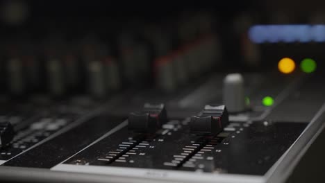 Macro-Shot-Of-Sound-Engineering-Audio-Mixer,-Shading-Light