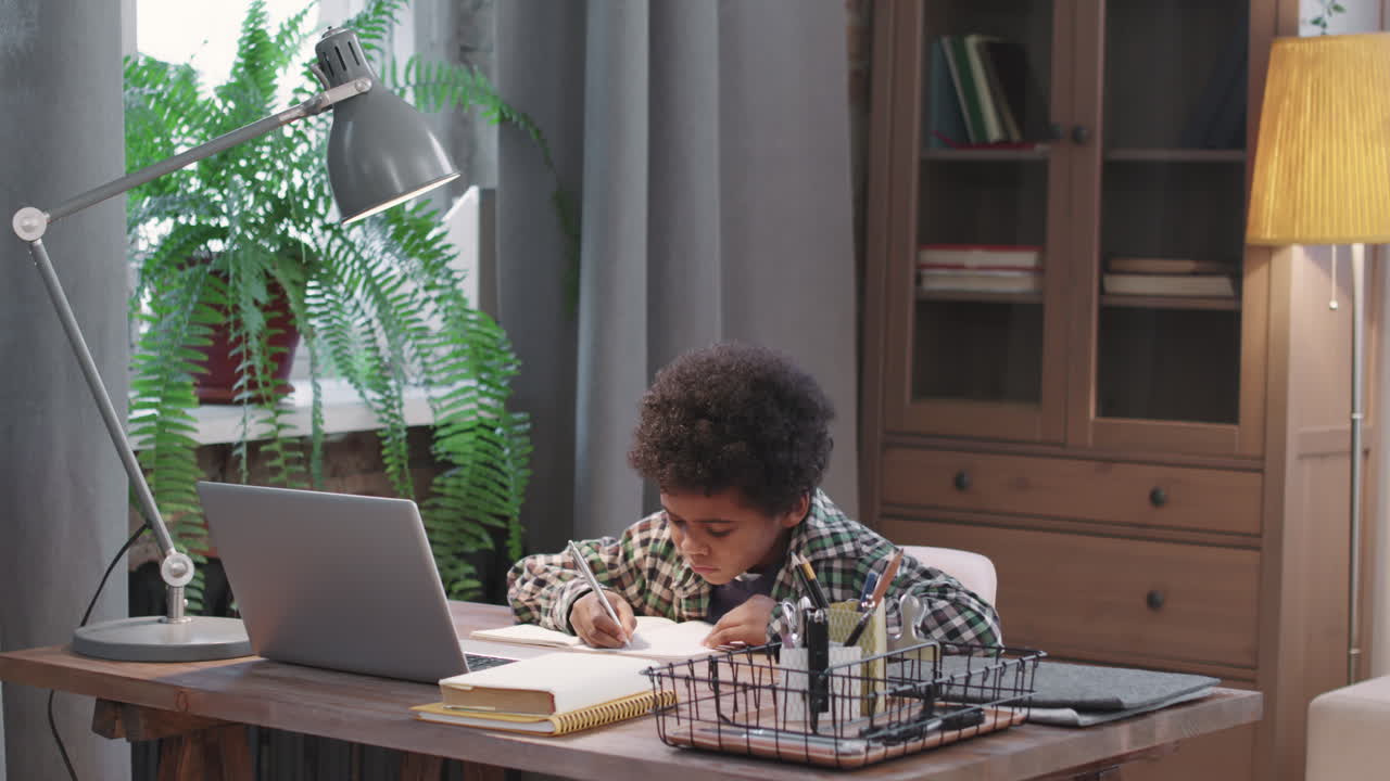 8-Year-Old Afro Boy Studying From Home