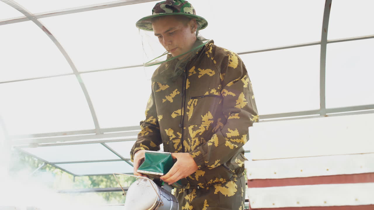 Beekeeper inspecting or working with beehives