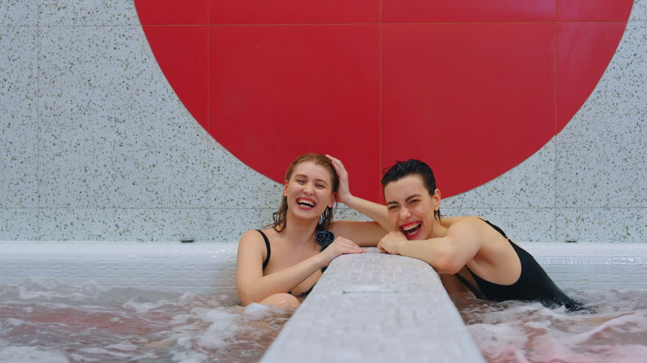 Two women enjoying a hot tub