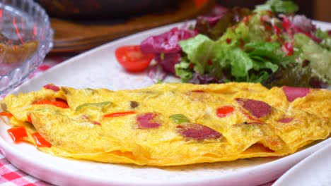 delicious omelette with sausage and green pepper for breakfast