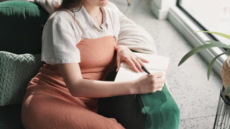 woman writing in her journal