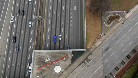 Epic-aerial-view-of-Downtown-Atlanta-busy-street-traffic-movement,-Cars-driving-on-urban-road,-Downtown-Atlanta,-Georgia,-USA