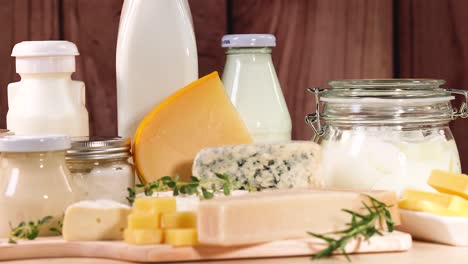 various dairy items displayed on a wooden surface