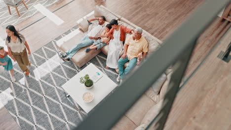 family relaxing on sofa