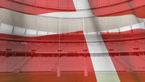 flag blowing in front of a stadium