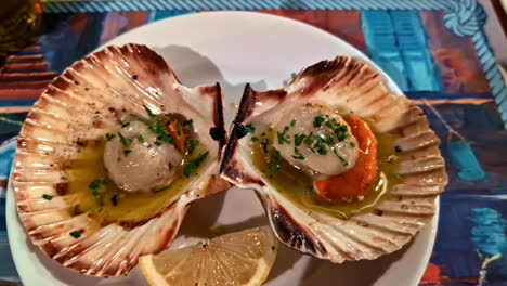 Shot of Oysters with pickled eggs and fish sauce served on shells. Greek dish.