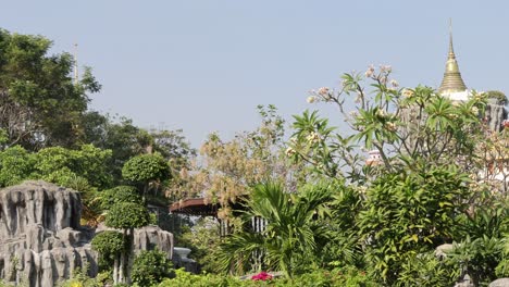 lush garden with pagoda in background