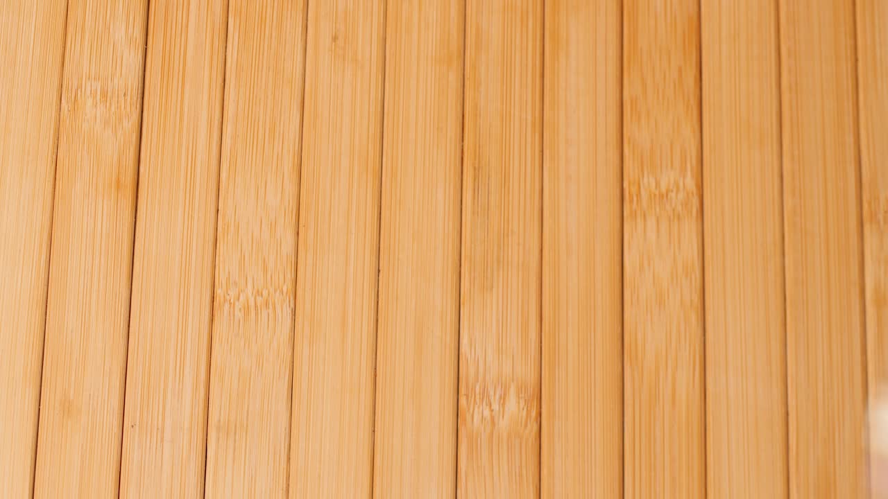 Placing Saffron threads in container on table