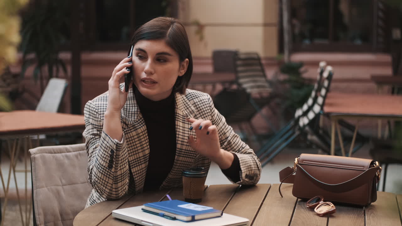 Beautiful woman working in courtyard of restaurant.