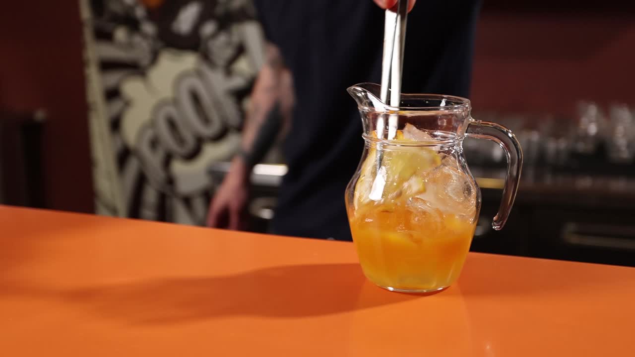 Orange Cocktail in Pitcher at a Bar