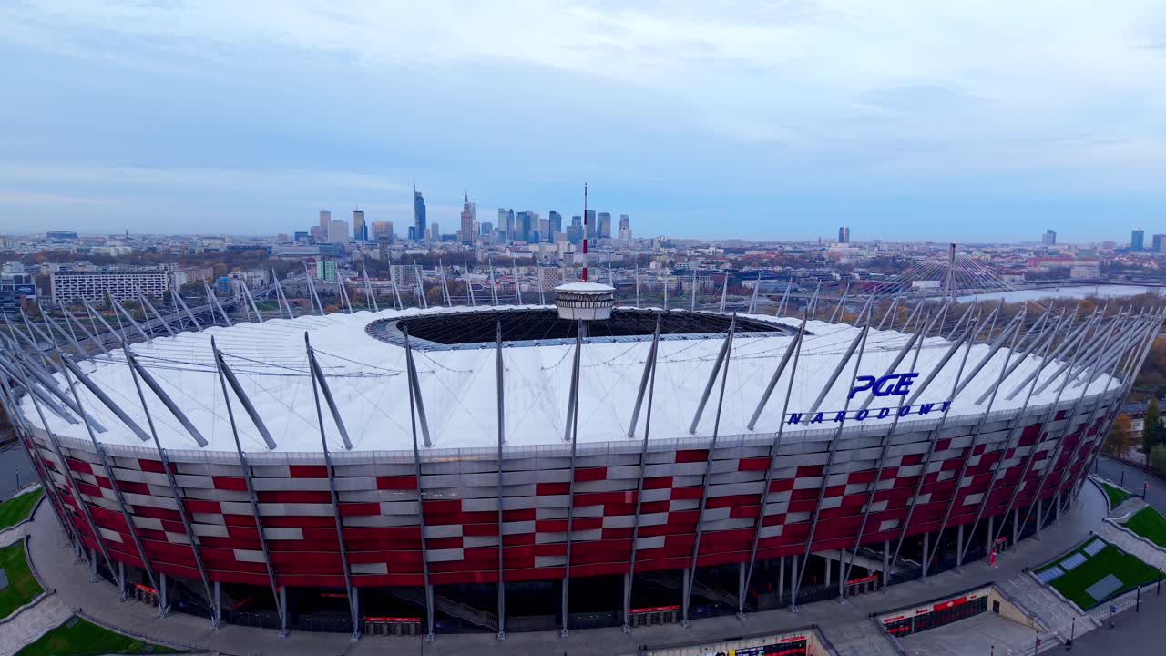 Aerial View of Warsaw Poland National Football Stadium, Modern Sports Arena With Downtown Skyscrapers in Background