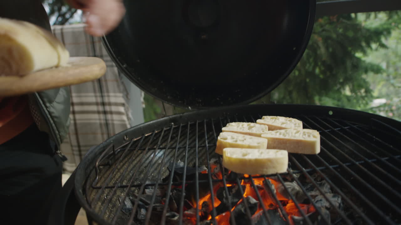 Man Cooking Bruschettas on BBQ