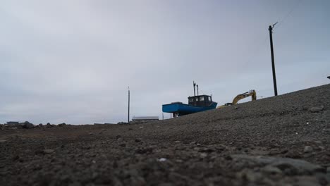 Beached-boat-up-a-stoney-hill