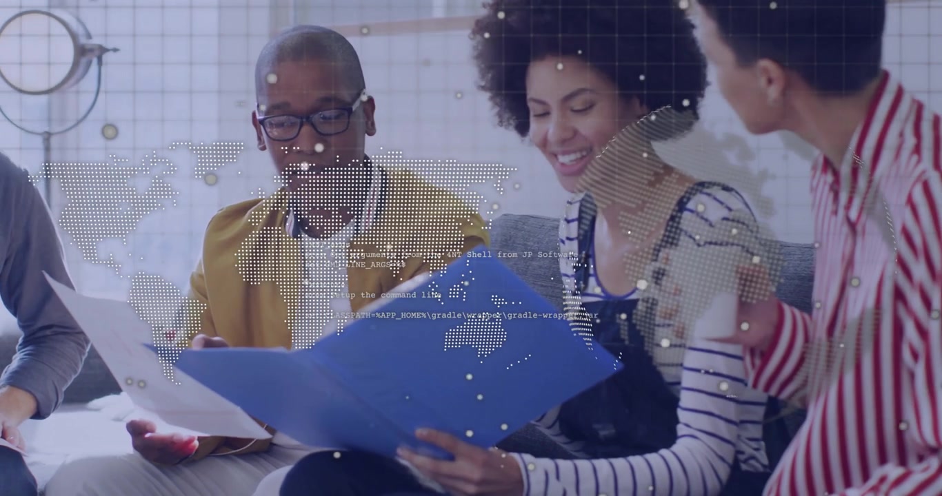 Team unfolding folder, leaning and reviewing documents while map graphics displaying business team
