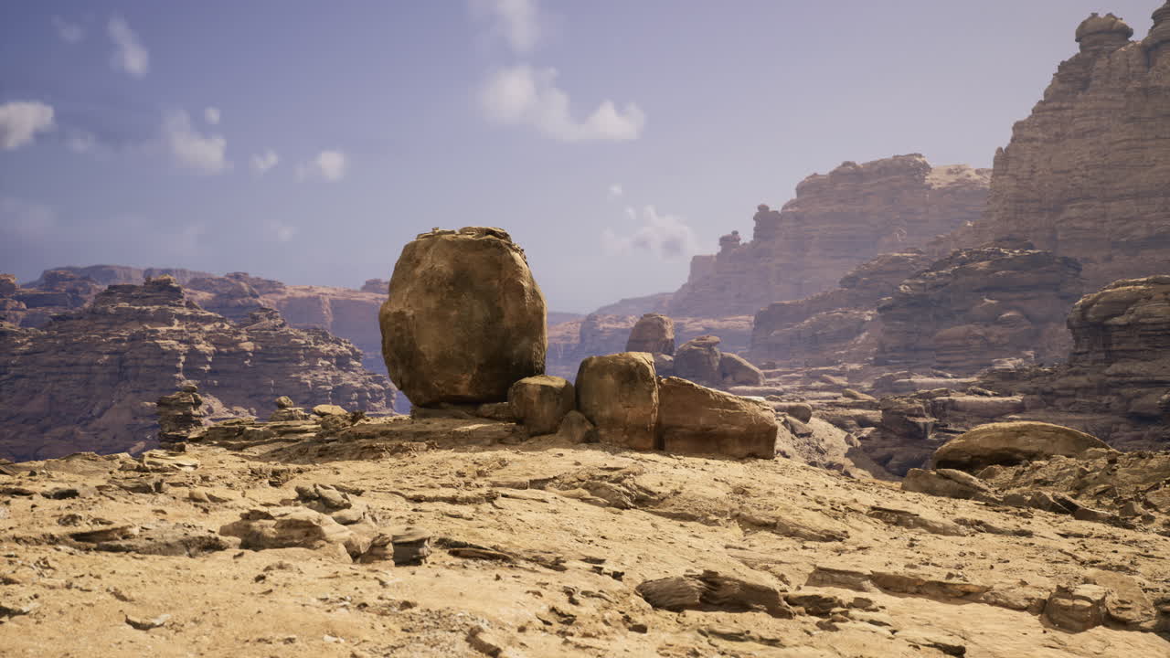 Desert landscape featuring large rock formations under a clear sky