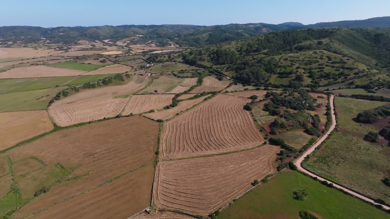Menorca island Spain rural countryside agriculture field rolling hills nature, aerial drone
