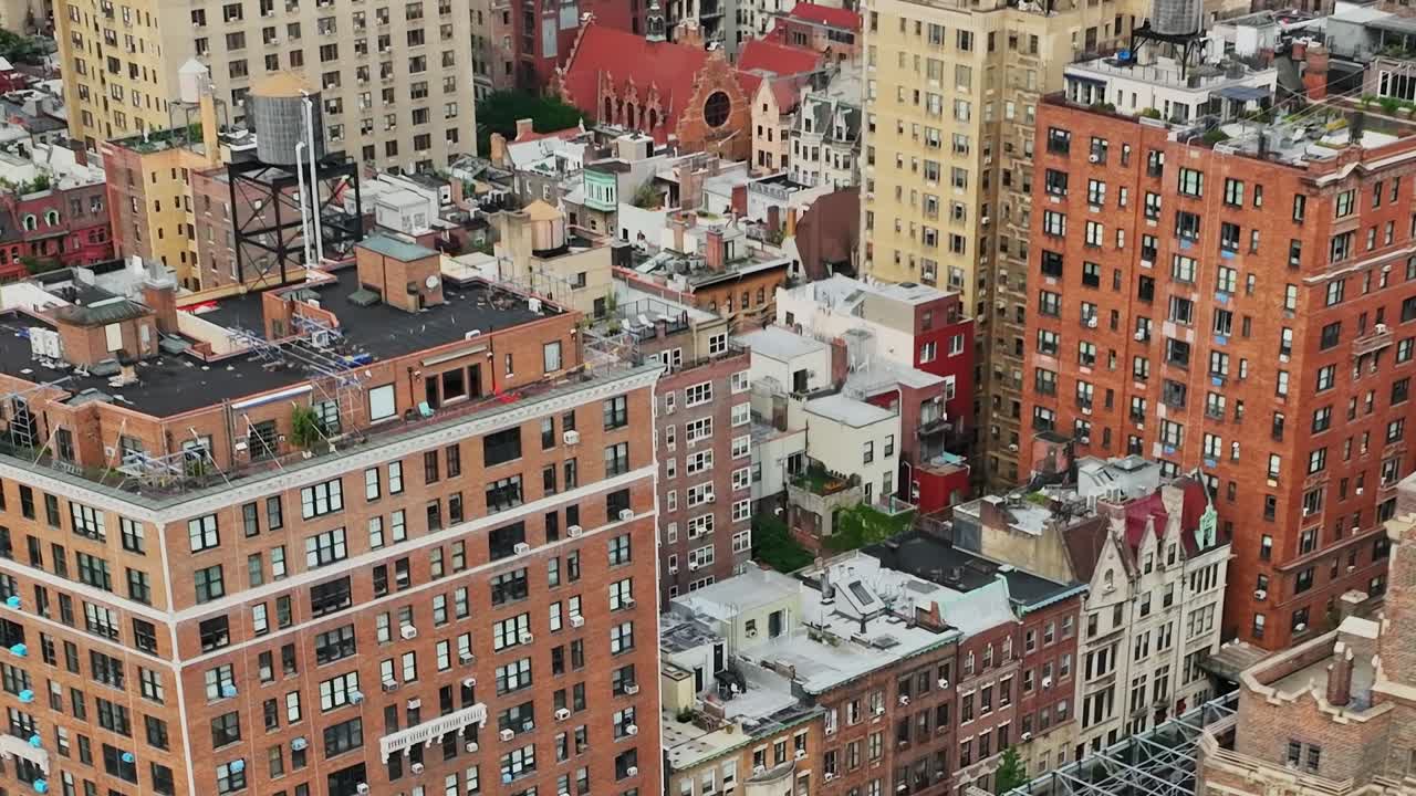 Drone view over New York City rooftops showcasing urban architecture