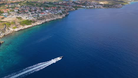 Speedboat-quickly-drives-across-deep-blue-Caribbean-waters-off-coast-of-Curacao