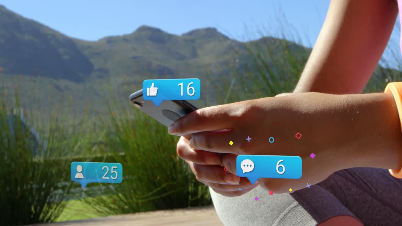 Animation of social media icons falling over person using smartphone