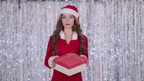 woman in santa claus costume with gift