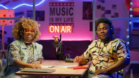 radio show hosts in a studio