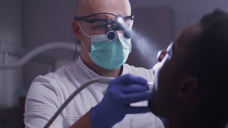 dentist examining patient's mouth