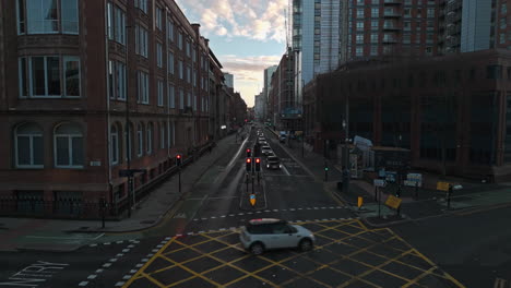 low pullback drone shot down wellington street on early morning in leeds uk