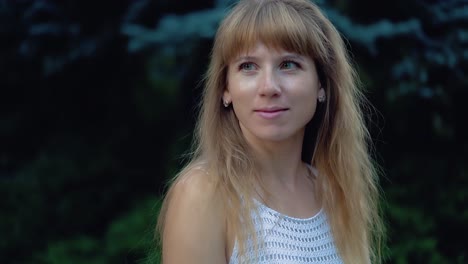 portrait of a young beautiful girl in the park