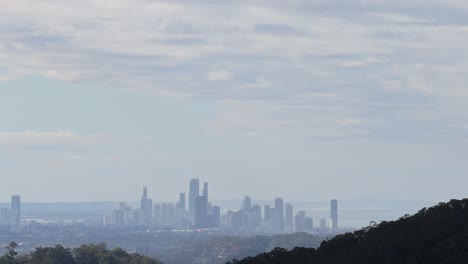 dynamic cloud movement above urban skyline panorama