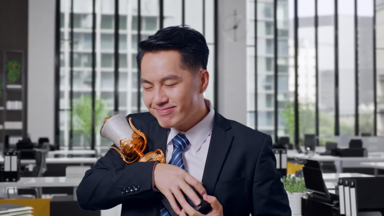 Businessman Celebrating Trophy Award