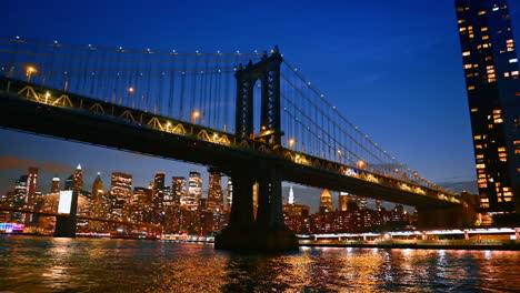 Manhattan Bridge skyline at night. Manhattan Bridge stands illuminated at night, showcasing the vibrant skyline of New York City across the water