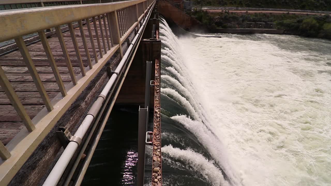 Fast flowing water over a dam