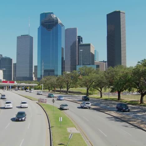 Cars-drive-along-a-highway-leading-into-downtown-Houston-1