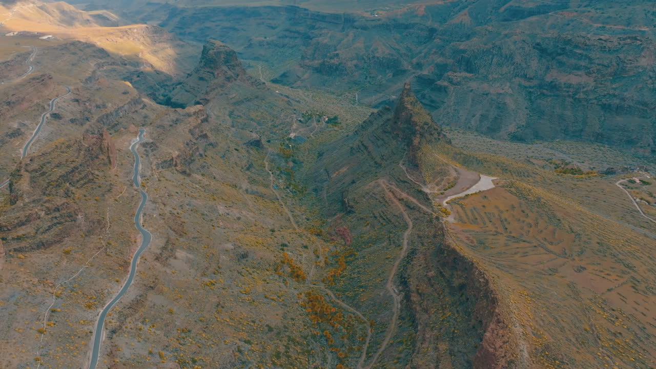 Aerial view of The fortress of Ansite in Gran canaria, canary islands, spain, with winding road and arid landscape
