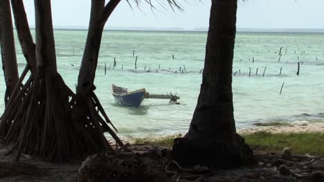fishermen small boat on fanning island atoll,tabuaeran, republic of kiribati