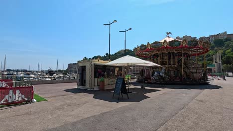 a carousel spinning near the monte carlo harbor