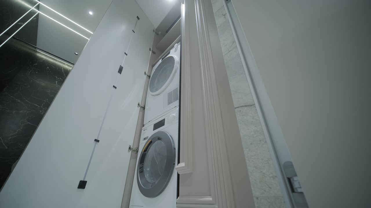 Modern Laundry Room with Stacked Washer and Dryer