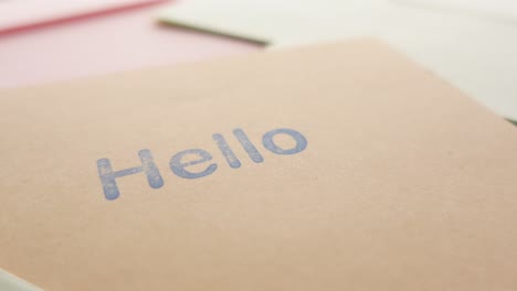 close up of hello text in blue  on a envelope