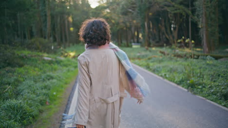 stylish girl looking nature walking road. woman traveler enjoying journey