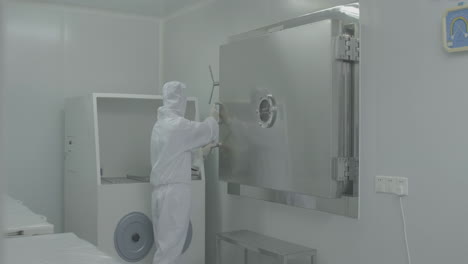 medical worker operate storage of vaccine vial are stored in lab refrigerators inside sterile production facility to ensure safety quality during manufacturing process for medical research diagnostics