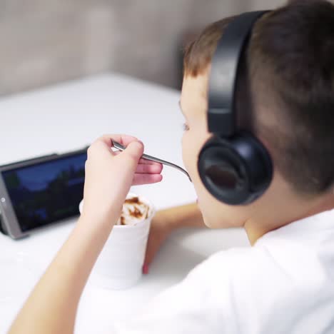 boy eating in kitchen