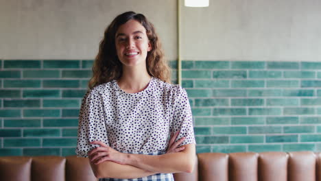 Portrait-Of-Smiling-Female-Owner-Or-Staff-Working-In-Cafe-Or-Coffee-Shop