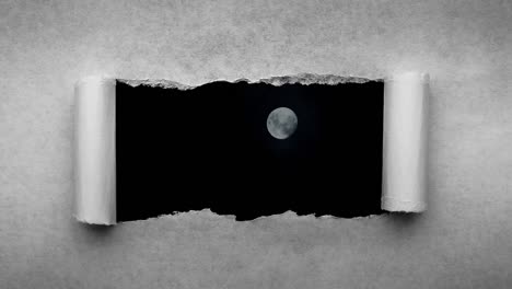 creative 4k time laps video of a glowing full moon in the night sky with floating clouds, which is visible through a hole with torn edges in old retro grunge vintage paper.