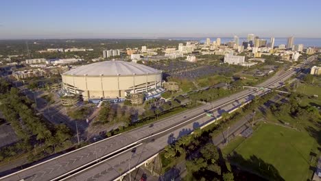 4k aerial drone video of interstate next to domed stadium of tampa bay rays in downtown st