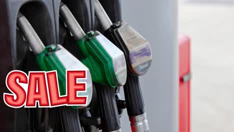 Animation-of-sale-text-in-red-over-row-of-fuel-pumps-at-petrol-station