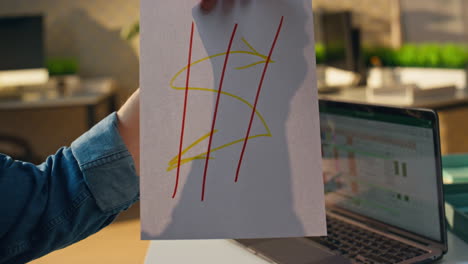 Freelancer hands showing sketch at sunny office close up. Man creating at desk